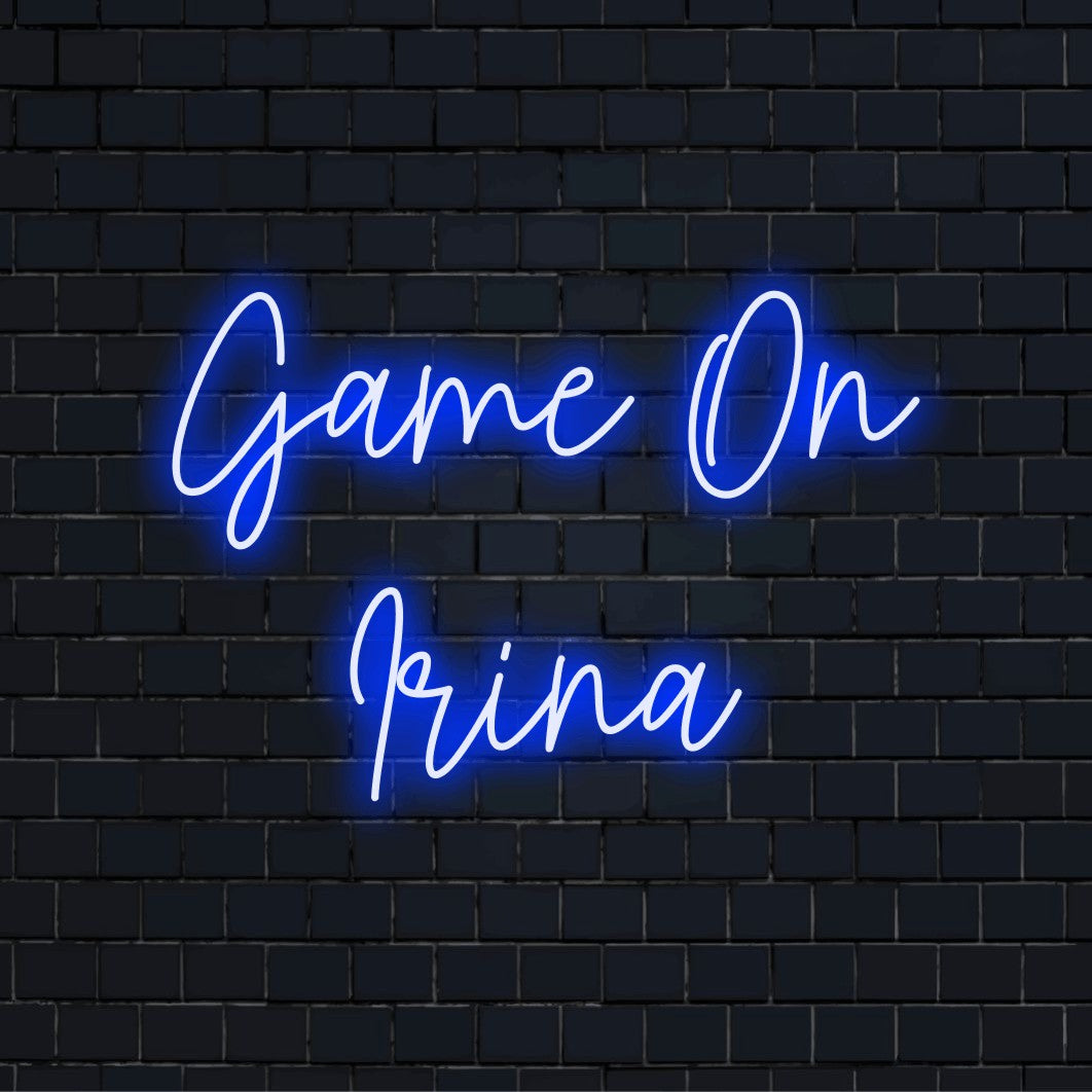 Game On Irina Custom Name Neon Sign, glowing lettering on black brick background