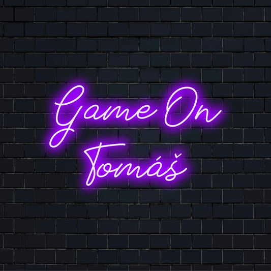 Game On Tomas Custom Name Neon Sign, soft neon glow on dark brick wall