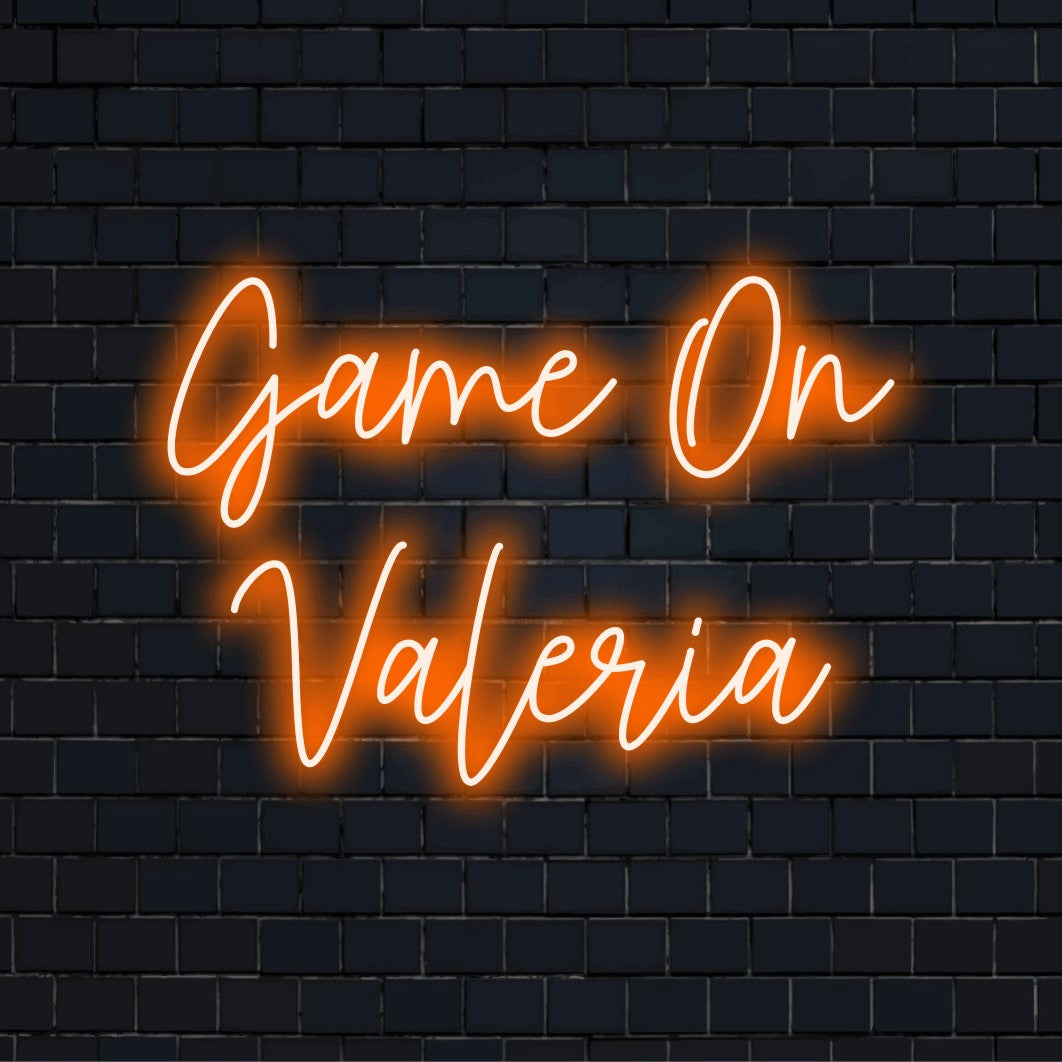 Game On Valeria Custom Name Neon Sign, bright neon glow on dark brick background