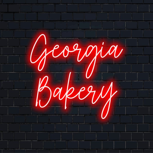Georgia Bakery Custom Name Neon Sign, glowing neon text against brick backdrop