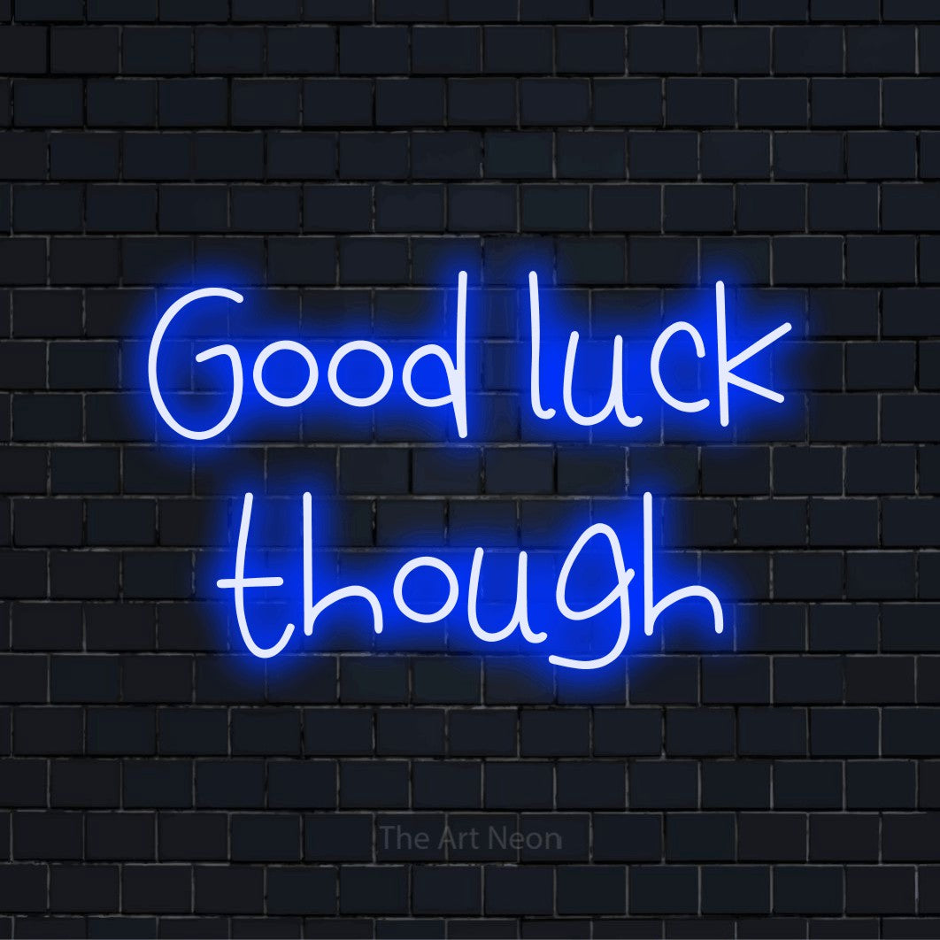 "Good Luck Though" script-style LED neon sign on a black brick wall