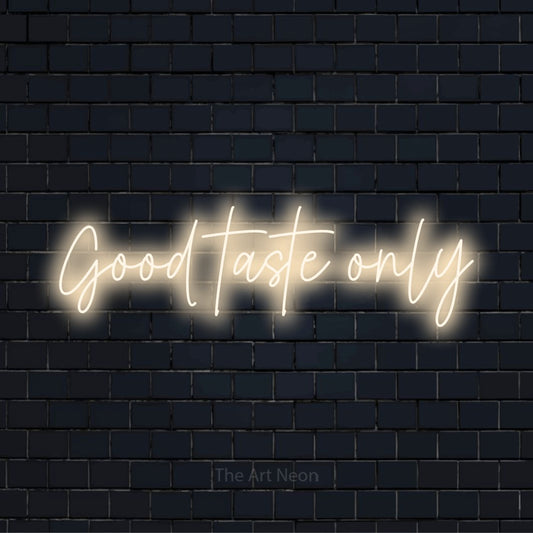 "Good Taste Only" neon text design on a black brick wall