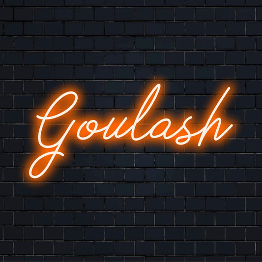 Goulash Neon Light with bright neon glow against brick backdrop