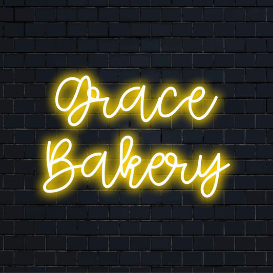 Grace Bakery Personalized LED Neon Sign, bright LED glow on black brick background