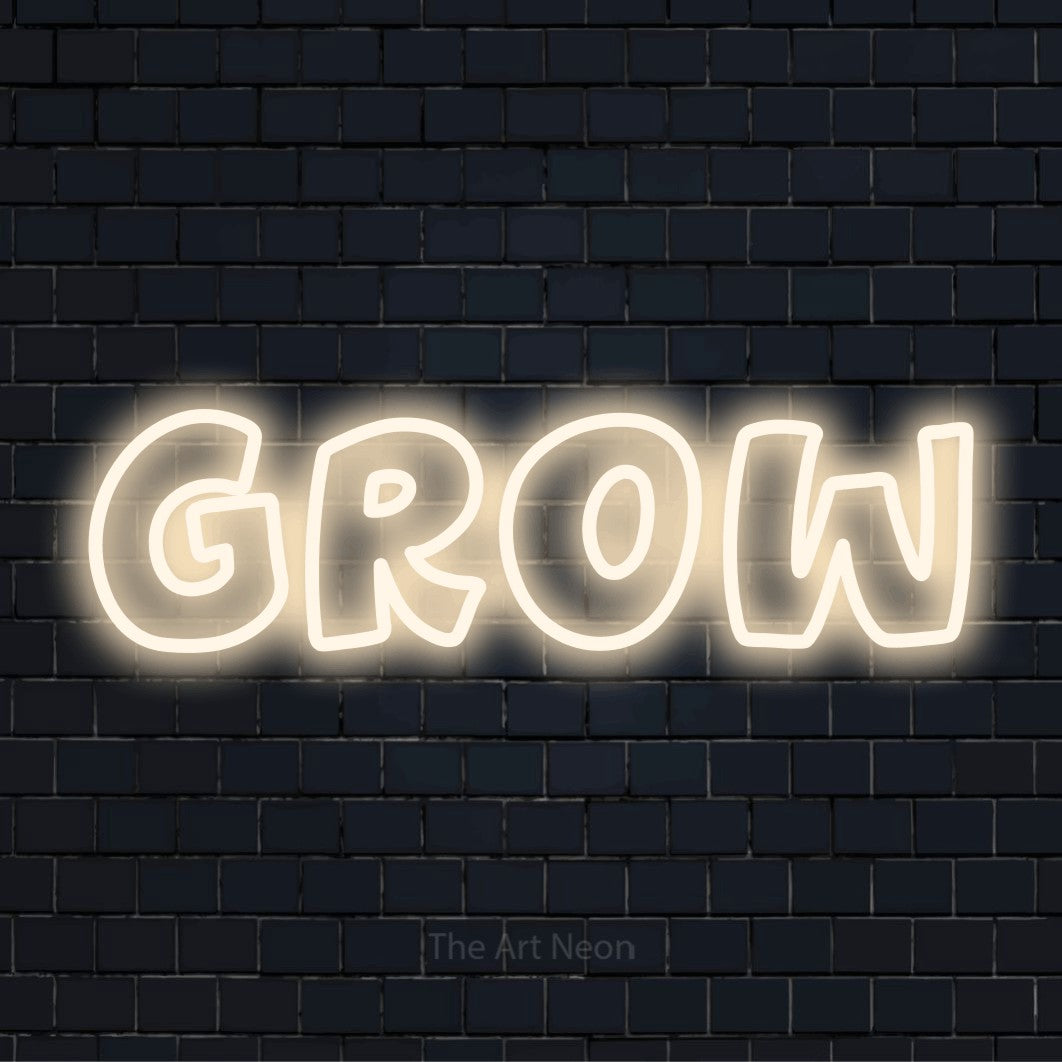 "Grow" script-style LED neon sign on a black brick wall