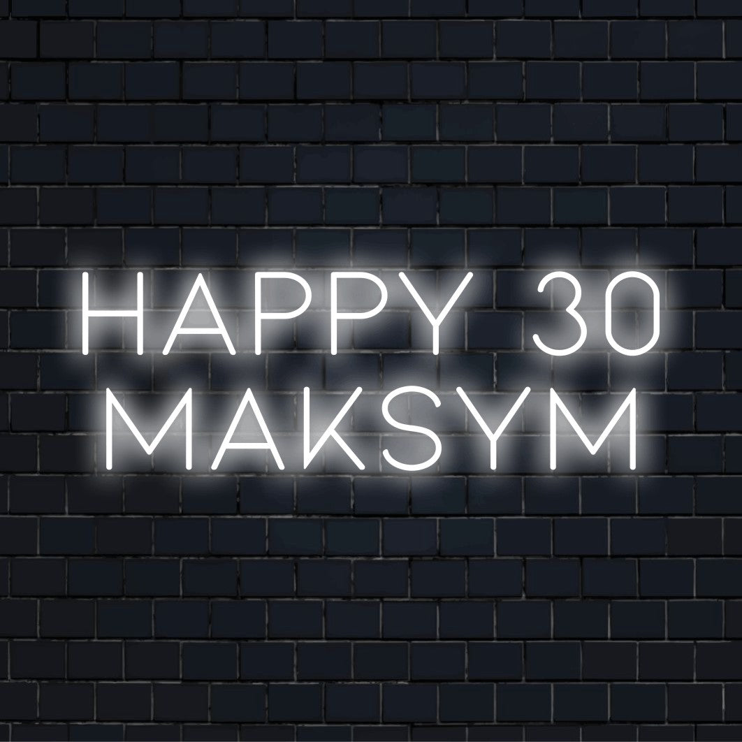 Happy 30 Maksym Personalized Neon Light with bright neon lettering against black brick wall