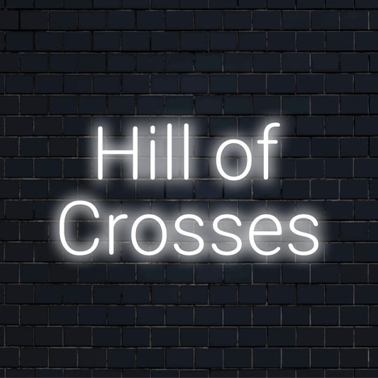 Hill Of Crosses Neon Sign, glowing wall decor against black brick wall