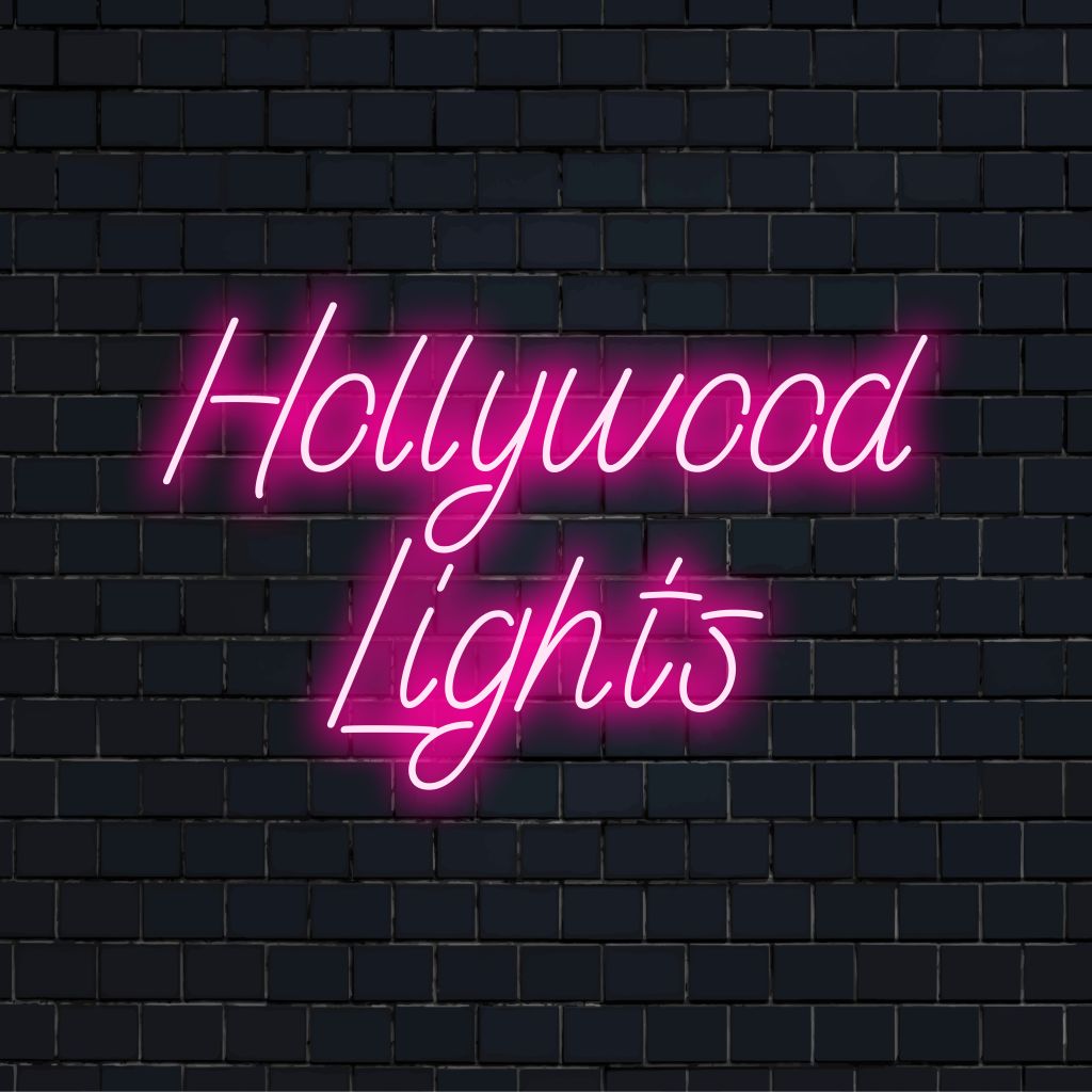 Hollywood Lights Neon Sign, neon text light against black brick wall
