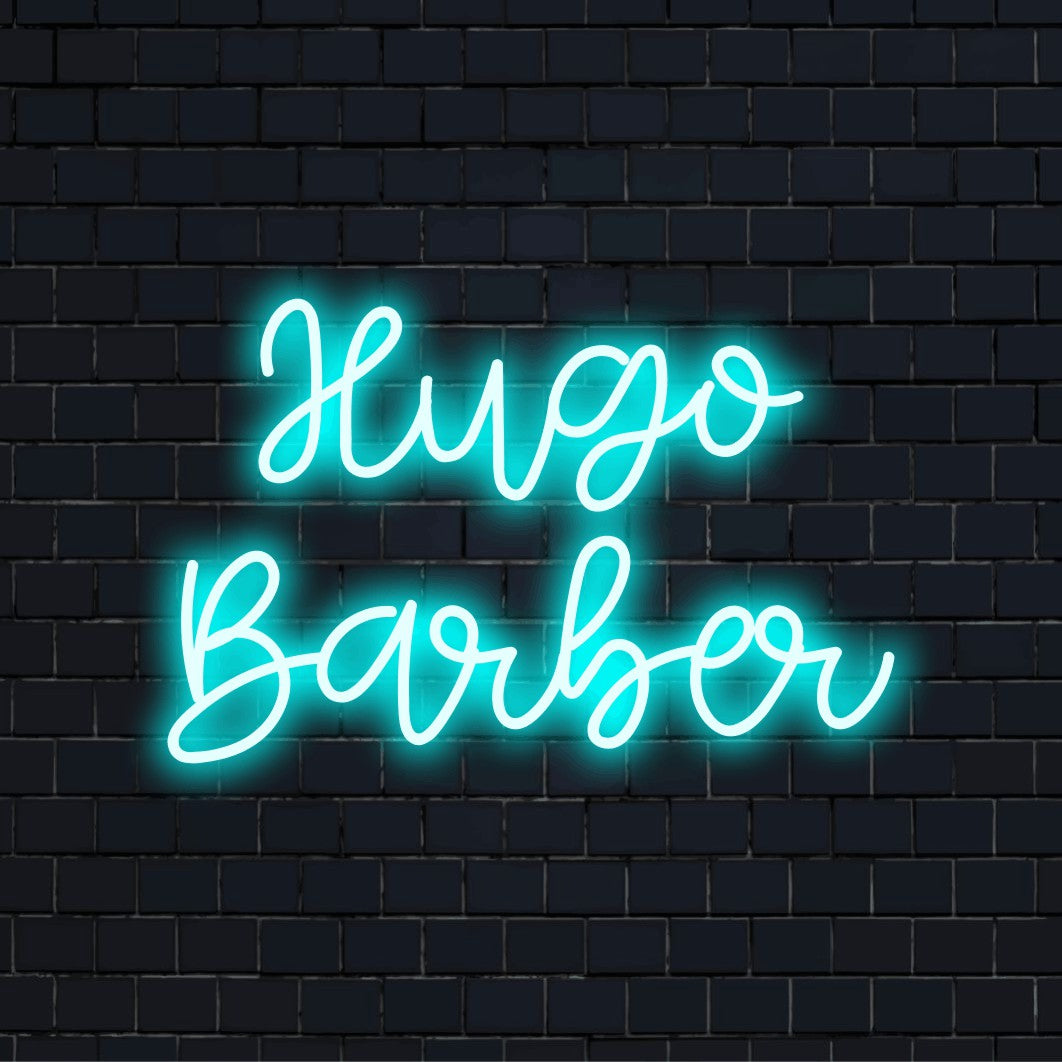Hugo Barber Personalized Neon Light with bright LED glow on dark brick background