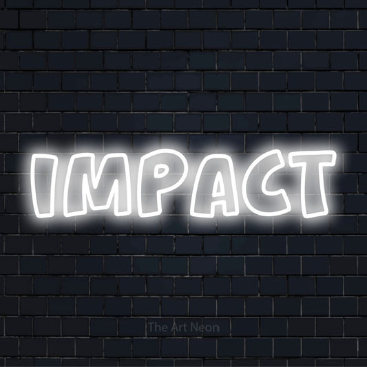 "Impact" script-style LED neon sign on a black brick wall