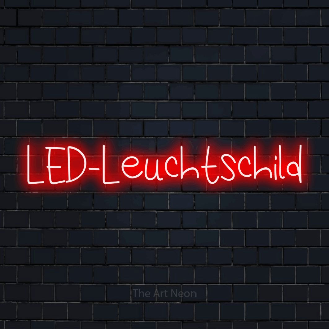 LED-Neonschild mit dem Text „LED-Leuchtschild“ auf dunkler Ziegelwand