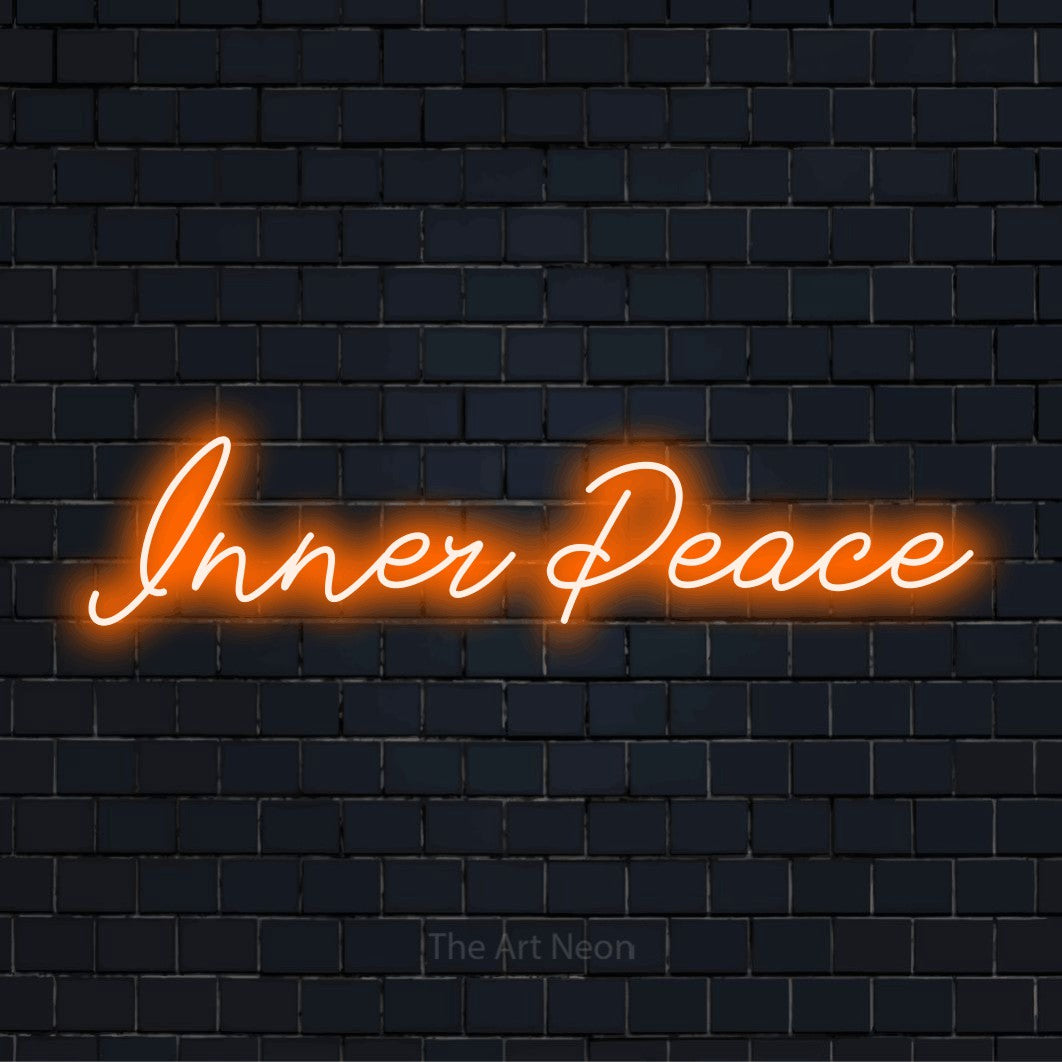 "Inner Peace" text design with neon effect on a black brick wall