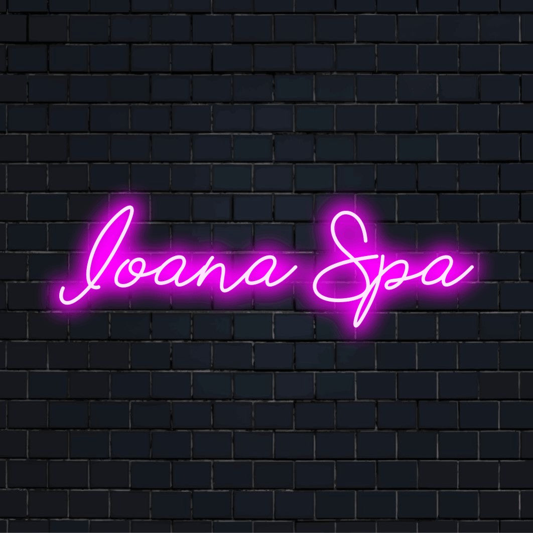 Ioana Spa Personalized LED Neon Sign, soft neon glow on dark brick wall