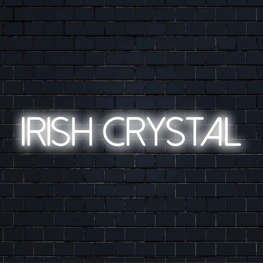 Irish Crystal Neon Sign, glowing neon text against black brick wall