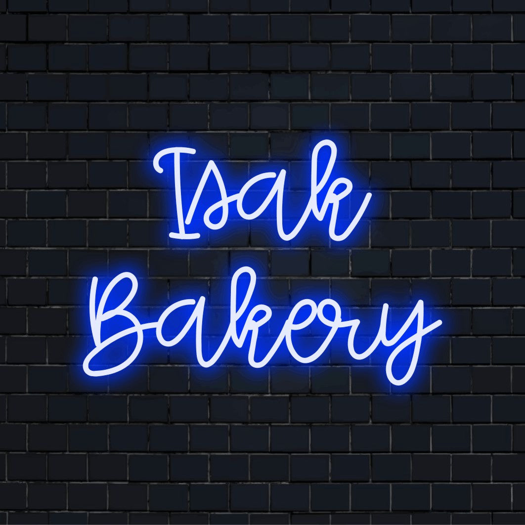 Isak Bakery Personalized LED Neon Sign, bright LED glow against black brick wall