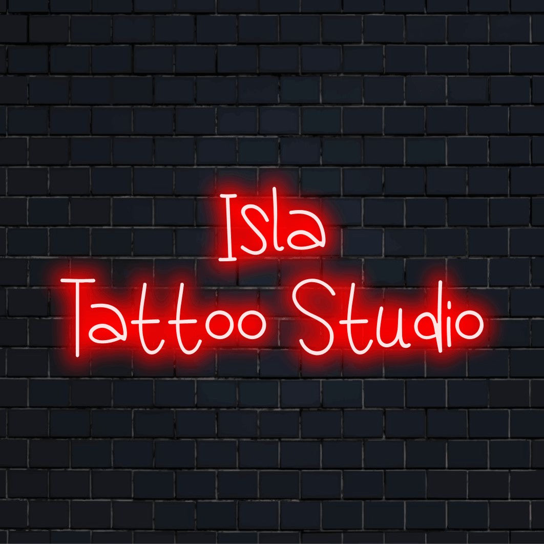 Isla Tattoo Studio Personalized LED Neon Sign, bright LED glow on dark brick wall