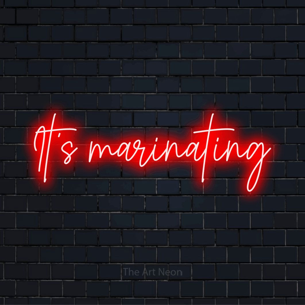 "It’s Marinating" script-style LED neon sign on a black brick wall