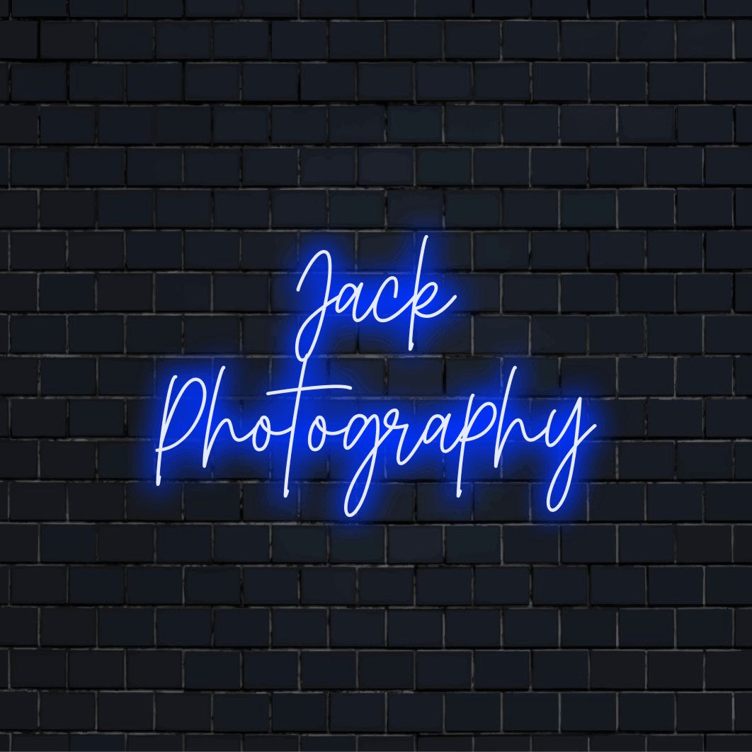 Jack Photography Custom Name Neon Sign, bright LED glow on black brick background