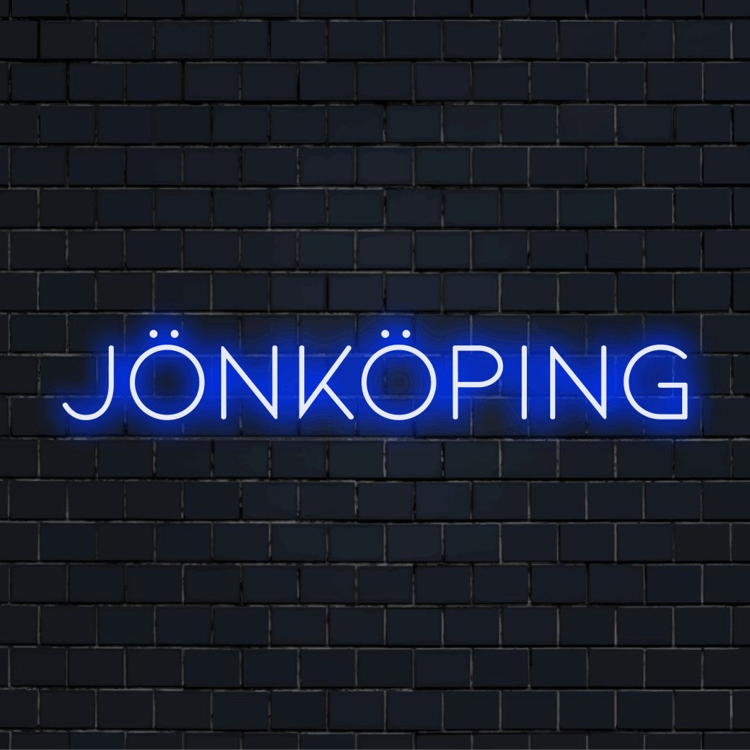 Jonkoping LED Neon Sign, glowing lettering against black brick wall