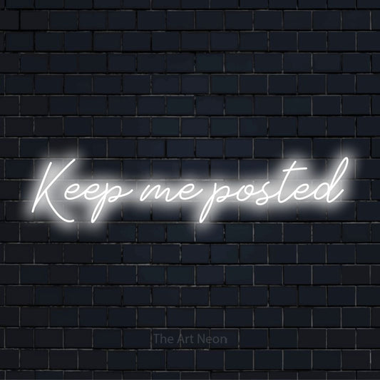 "Keep Me Posted" neon text design on a black brick wall