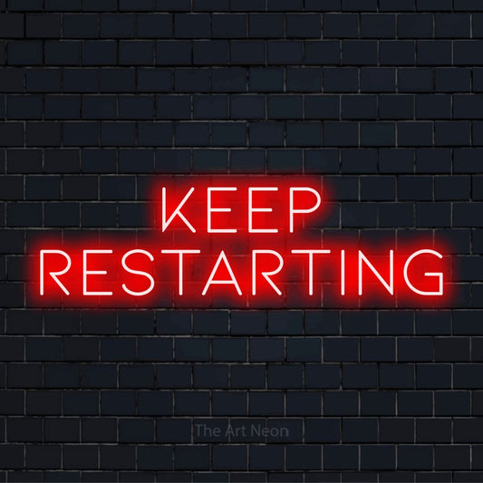 "Keep Restarting" neon text design on a black brick wall