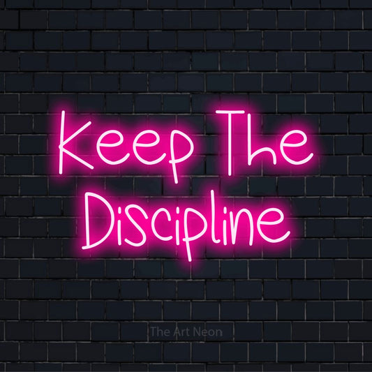 "Keep The Discipline" neon text design on a black brick wall