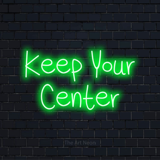 "Keep Your Center" LED neon sign on a black brick wall