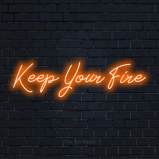"Keep Your Fire" neon text design on a black brick wall