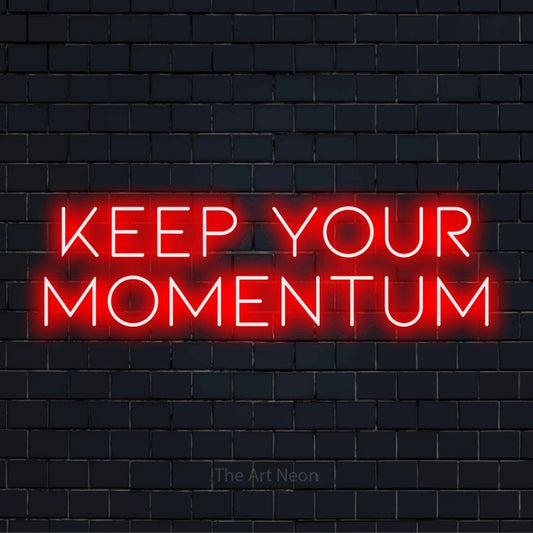 "Keep Your Momentum" neon text design on a black brick wall