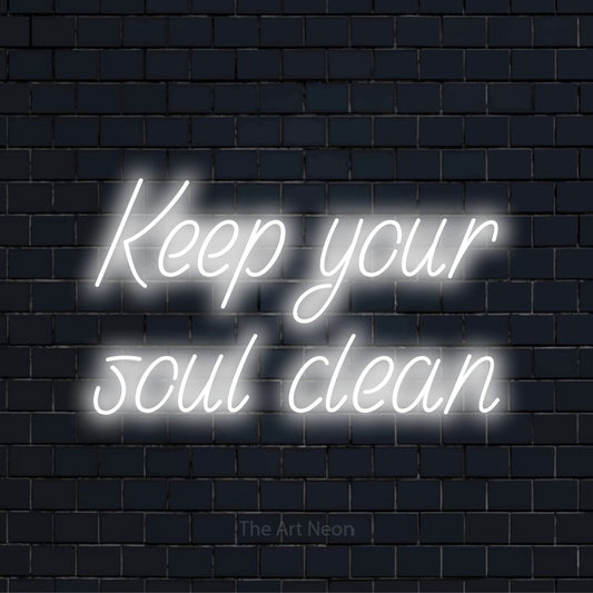 "Keep Your Soul Clean" neon text design on a black brick wall