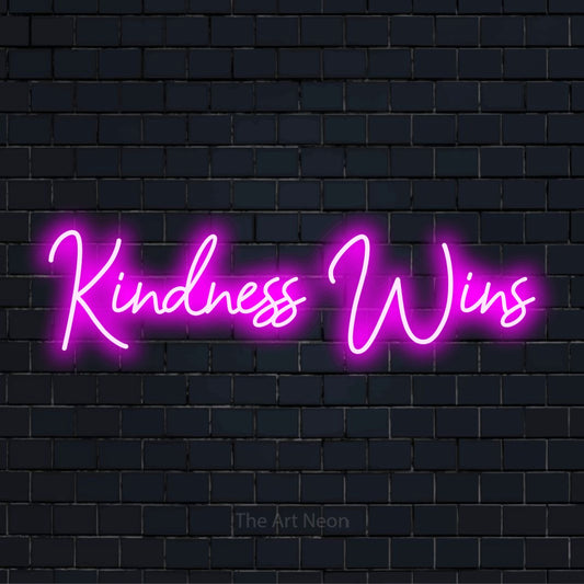 "Kindness Wins" text design with neon effect on a black brick wall