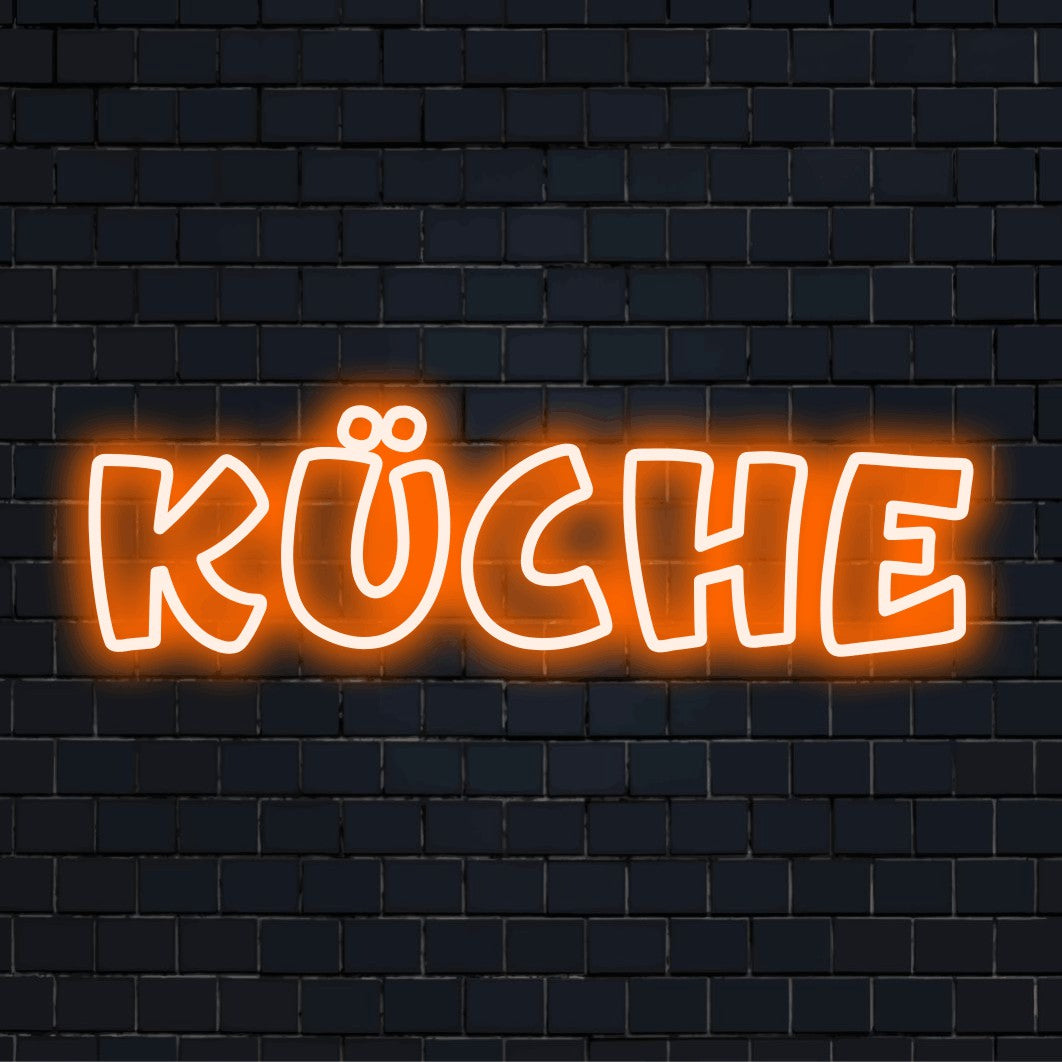 LED-Neonschild mit dem Text „Küche“ auf dunkler Ziegelwand