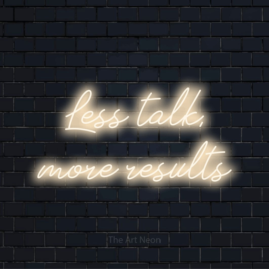 "Less Talk, More Results" neon text design on a black brick wall