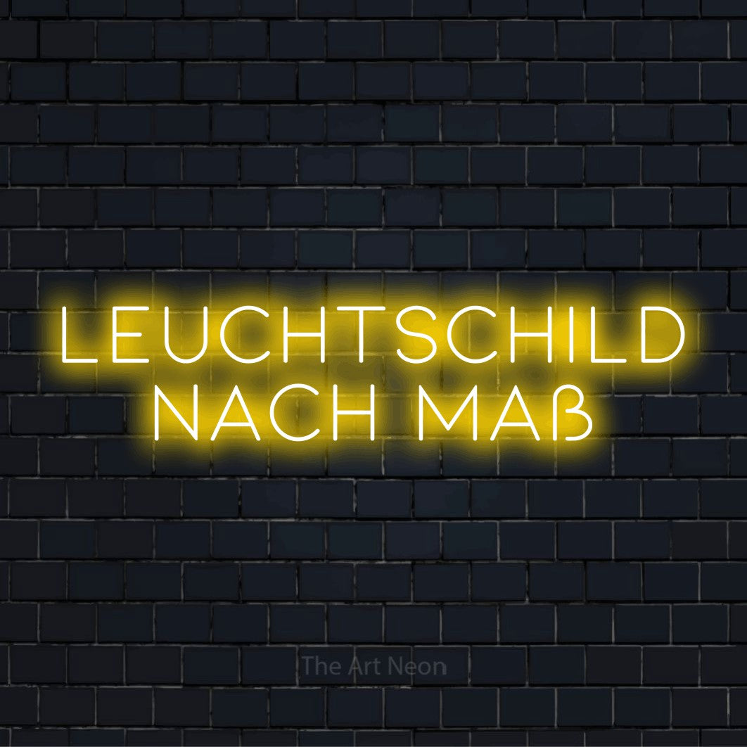LED-Neonschild mit dem Text „Leuchtschild nach Maß“ auf dunkler Ziegelwand
