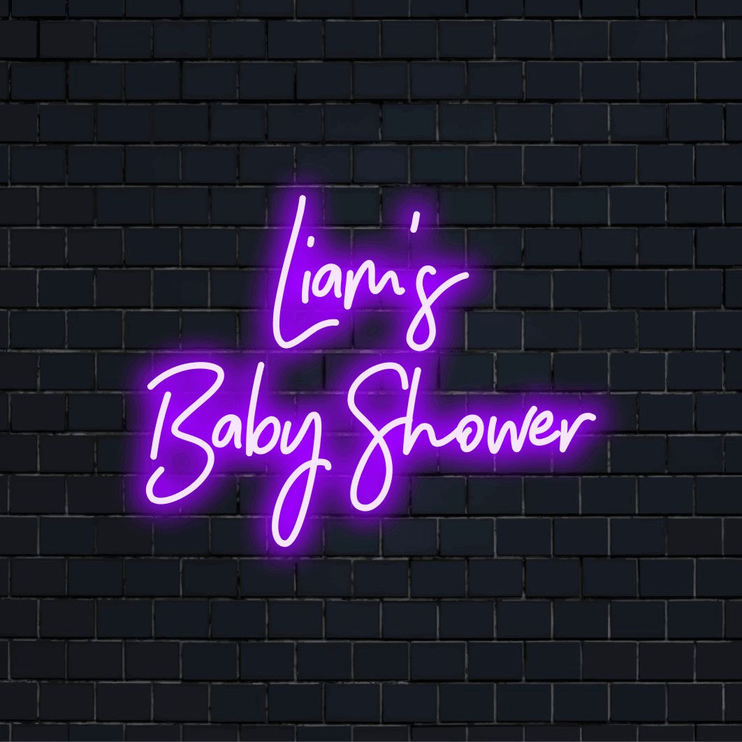 Liam_s Baby Shower Personalized Neon Light with glowing lettering on black brick background