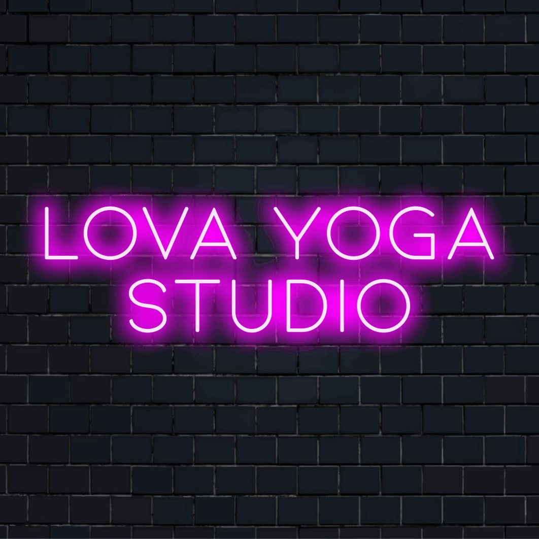 Lova Yoga Studio Personalized LED Neon Sign, glowing lettering on black brick background
