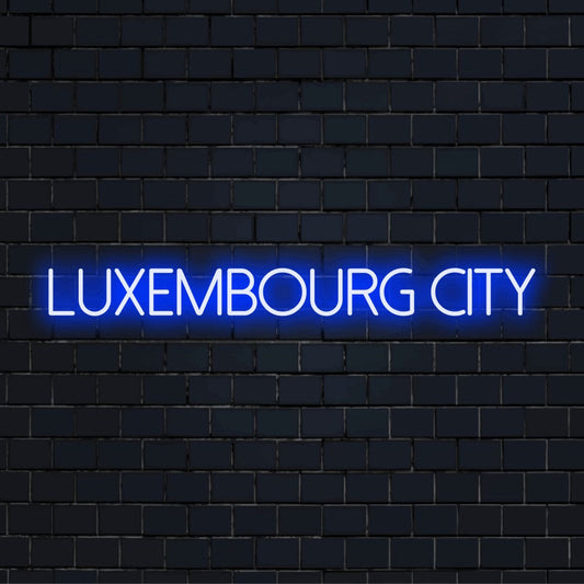 Luxembourg City Neon Light with neon text light against brick backdrop