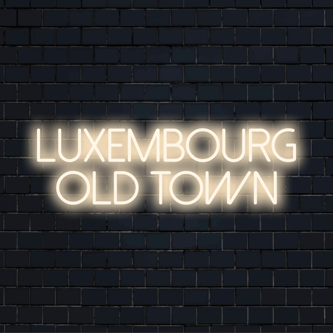 Luxembourg Old Town Neon Sign, bright neon lettering on dark brick background