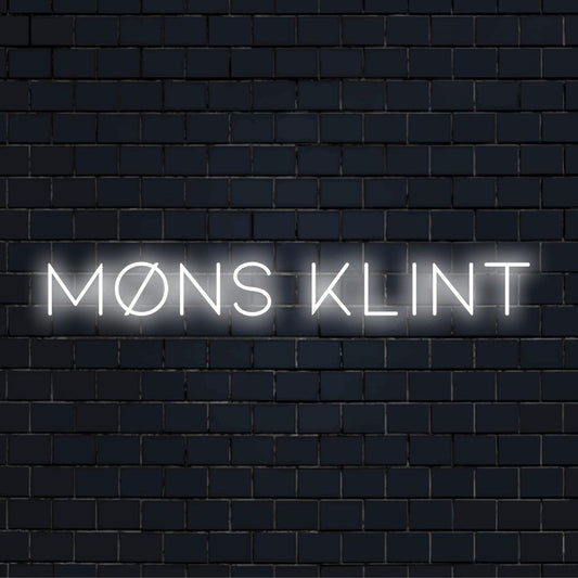 M Ns Klint LED Neon Sign, glowing lettering against brick backdrop