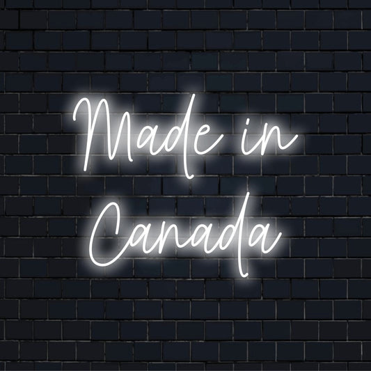 Made In Canada LED Neon Sign, glowing lettering on black brick background