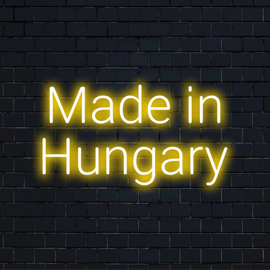 Made In Hungary Neon Sign, bright neon lettering on dark brick wall