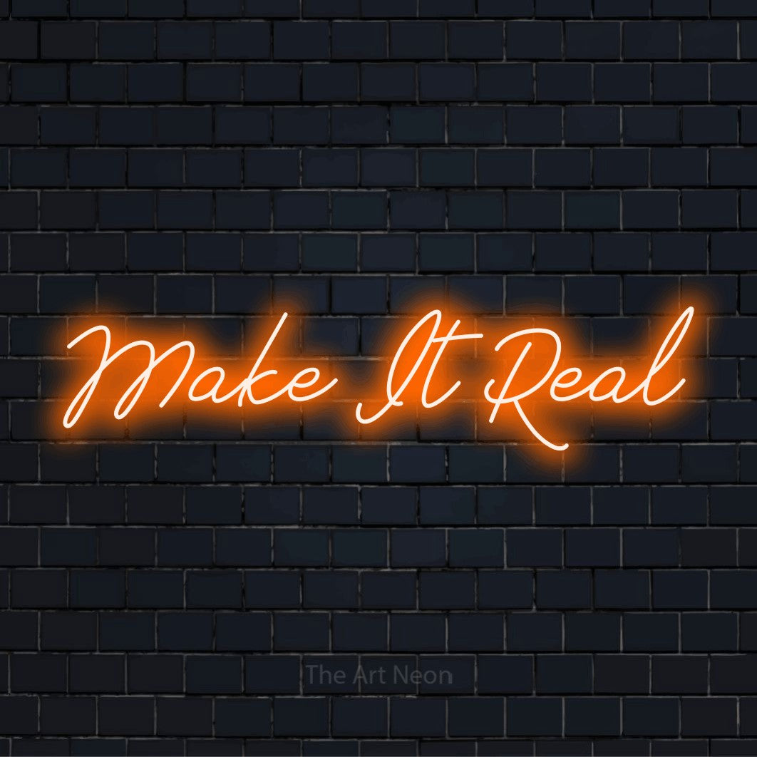 "Make It Real" LED neon sign on a black brick wall