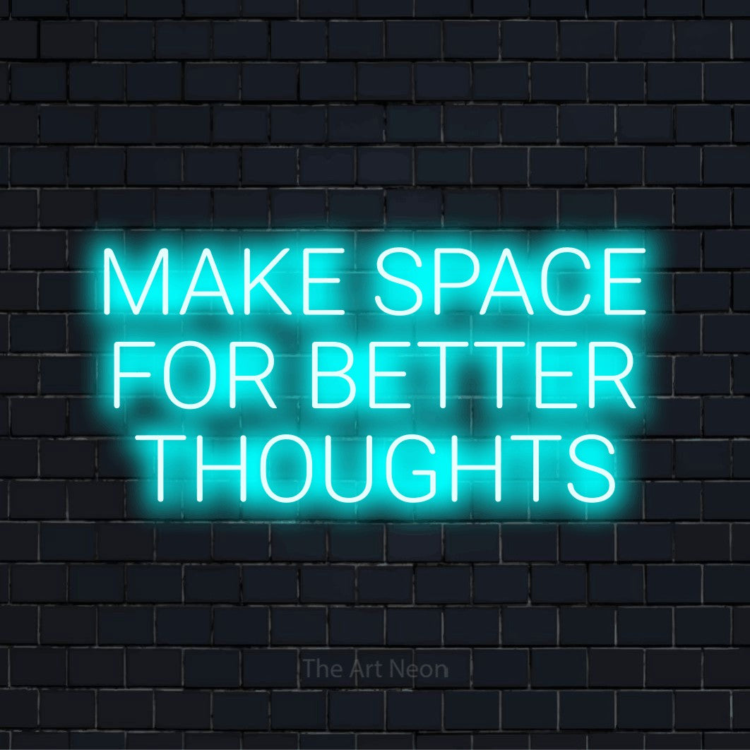 "Make Space For Better Thoughts" LED neon sign on a black brick wall
