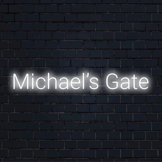 Michael S Gate Neon Sign, glowing wall decor on dark brick wall