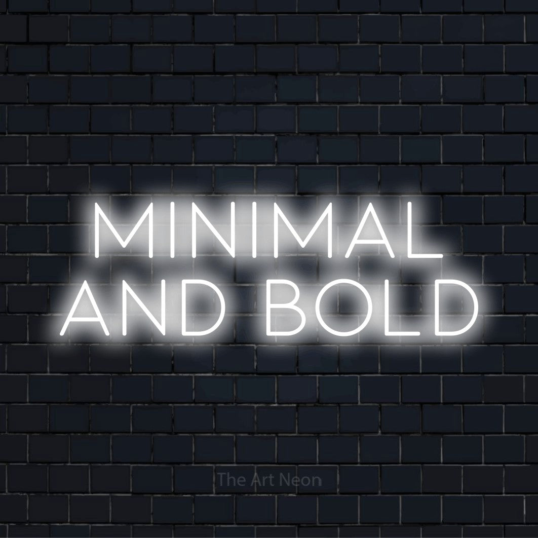 "Minimal And Bold" glowing LED neon sign on a black brick wall