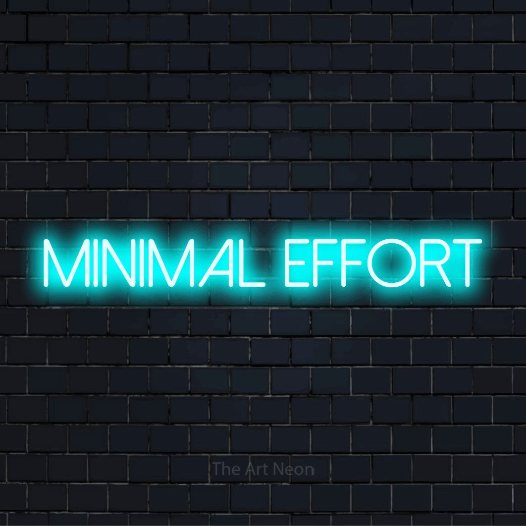 "Minimal Effort" script-style LED neon sign on a black brick wall