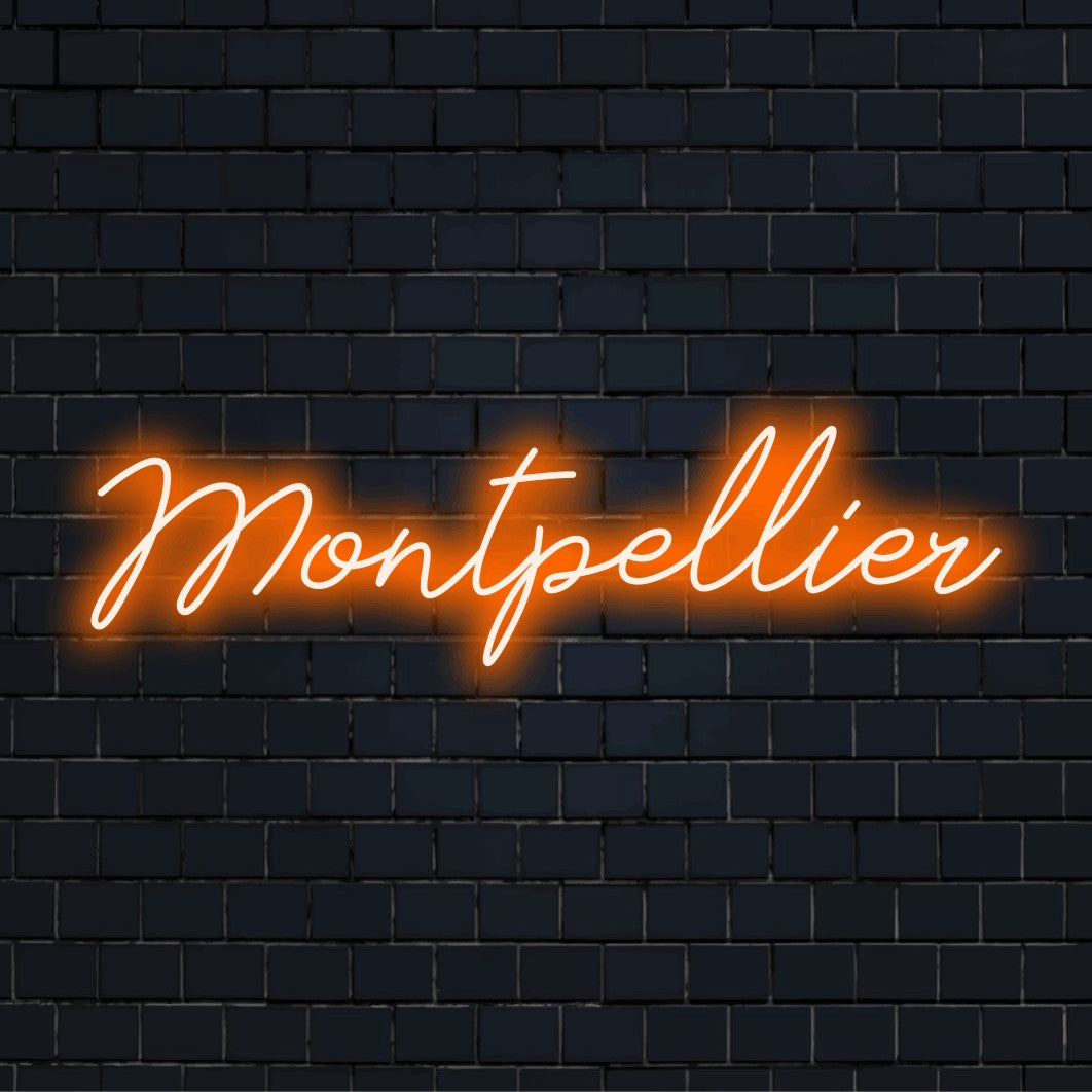 Montpellier Neon Sign, neon text light against brick backdrop