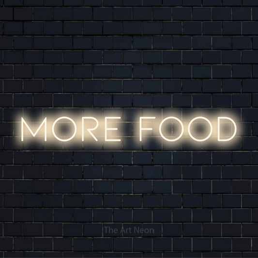 "More Food" LED neon sign on a black brick wall