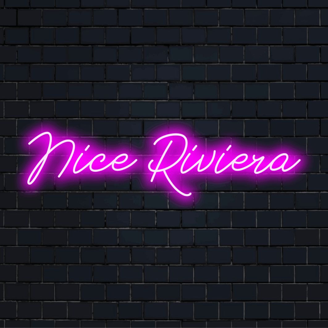 Nice Riviera LED Neon Sign, glowing neon text against black brick wall
