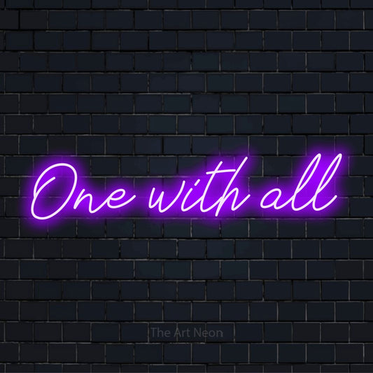 "One With All" script-style LED neon sign on a black brick wall